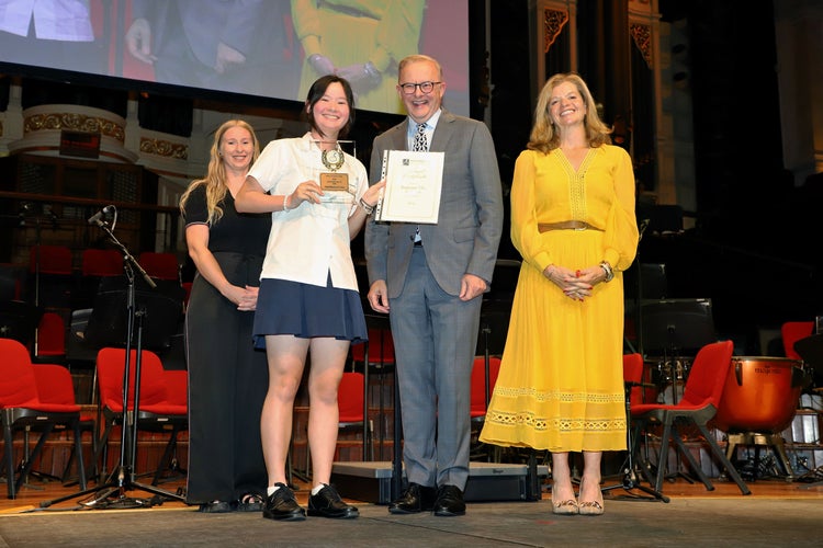 A student received an award from Prime Minister Anthony Albanese