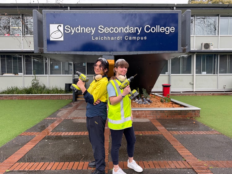 Two students hold drills as part of their VET training