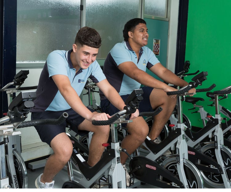 Two students on exercise bikes
