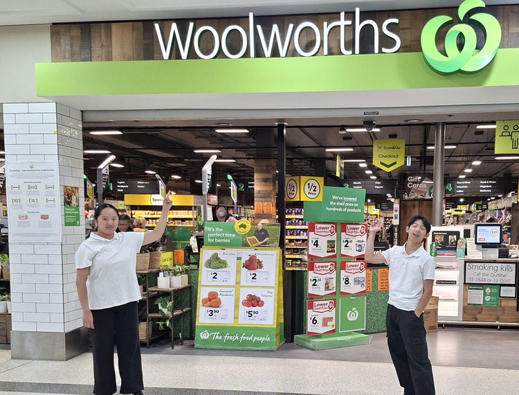 Two students undergoing work experience at their local supermarket