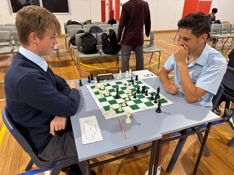 Two students playing chess