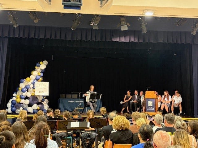 A student performs on stage at the recognition ceremony.